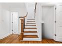 Elegant staircase with wood treads, white risers, and a detailed wood banister at 1659 Executive Park Ne Ln, Brookhaven, GA 30329