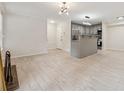 Spacious living room area with tiled flooring, neutral walls, and modern lighting fixtures throughout at 434 Mcgill Ne Pl, Atlanta, GA 30312