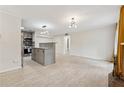 Bright and airy living room area with tiled floors offering a flexible design and easy transition to the kitchen at 434 Mcgill Ne Pl, Atlanta, GA 30312