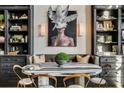Dining area boasts a unique table and chairs setup, with stylish decor and built-in black shelving at 170 Boulevard Se # 412E, Atlanta, GA 30312