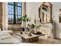 Cozy living room with fireplace, large windows, and a comfortable sofa, creating a relaxing atmosphere at 170 Boulevard Se # 412E, Atlanta, GA 30312