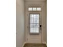 Close-up of the front door with glass window and blinds, providing privacy and natural light at 1883 Frisco Way, Suwanee, GA 30024