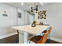 Kitchen island with bar seating, pendant lighting, and modern decor at 215 Piedmont Ne Ave # 1509, Atlanta, GA 30308