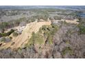 Aerial view of the property and surrounding neighborhood in a natural setting at 202 Neely Rd, Fayetteville, GA 30214