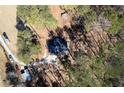 Aerial view of the property highlighting the home's location among mature trees at 202 Neely Rd, Fayetteville, GA 30214