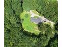 Expansive aerial view showcasing the property's secluded setting surrounded by lush trees and greenery at 2750 Old Horseshoe Bend Sw Rd, Marietta, GA 30064