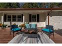 Charming front porch with stylish outdoor furniture, creating a welcoming entrance to the home at 2750 Old Horseshoe Bend Sw Rd, Marietta, GA 30064