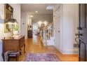 Inviting foyer with hardwood floors and a staircase leading to the upper level at 3923 Ashford Ne Trl, Brookhaven, GA 30319