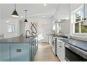 Beautiful kitchen featuring an island, stainless steel appliances, and stone countertops at 3326 Springhaven Ave, Hapeville, GA 30354