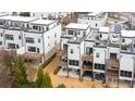 Exterior rear view of modern townhomes featuring private decks and yard space at 4374 Benfield Se Way, Smyrna, GA 30080