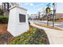 Street view of building address with beautiful flower garden in a modern community at 4374 Benfield Se Way, Smyrna, GA 30080