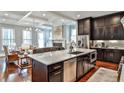 Modern kitchen featuring a large center island, stainless steel appliances, and an open layout at 1180 John Collier Rd, Atlanta, GA 30318