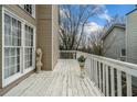 Open deck featuring a white railing, offering an inviting outdoor space and a view of the surrounding neighborhood at 1675 Paddlewheel Dr, Marietta, GA 30062