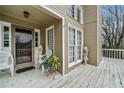 Welcoming front porch featuring a decorative glass front door, adorned with a beautiful planter and decorative statues at 1675 Paddlewheel Dr, Marietta, GA 30062