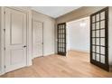 Spacious office featuring wood floors, multiple doorways and windows, and neutral paint tones at 3927 Enclave Way, Tucker, GA 30084