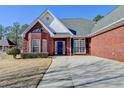 Beautiful brick home with a manicured front yard and a covered entrance in a desirable neighborhood at 337 Inverness Ave, Mcdonough, GA 30253