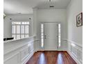 Bright and airy foyer features hardwood floors and elegant trim, creating a welcoming entrance at 337 Inverness Ave, Mcdonough, GA 30253