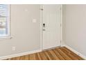 Bright entryway featuring a modern white door, new vinyl floor, and neutral wall color at 6071 Cristie Dr, Ellenwood, GA 30294