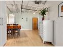 Dining area features hardwood floors, a modern chandelier, and storage at 878 Peachtree Ne St # 431, Atlanta, GA 30309