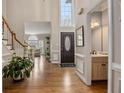 Bright foyer featuring hardwood floors, a tall window and a view to the Living Room at 12015 Wildwood Springs Dr, Roswell, GA 30075