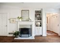 Cozy living room featuring fireplace, built-in shelves, and pristine white walls at 104 Terrace Dr # 6, Atlanta, GA 30305