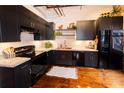 Modern kitchen with black cabinets, granite countertops, and stainless steel appliances at 342 Marietta Nw St # 8, Atlanta, GA 30313