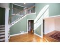 Grand foyer with hardwood floors, staircase, and an open layout, creating a welcoming entrance at 3595 Mason Ridge Dr, Winston, GA 30187