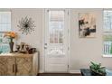 Bright entryway featuring modern decor, stylish wall art, and a view of the outdoors at 613 Everett Ln, Woodstock, GA 30188