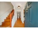 Welcoming entryway featuring hardwood floors and staircase with classic design at 810 Towergate Pl, Atlanta, GA 30350