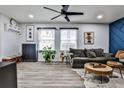 Bright living room featuring hardwood floors, modern decor, and a cozy seating arrangement at 15 Pine Canyon Sw Dr, Atlanta, GA 30331