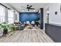 Bright living room featuring hardwood floors, modern decor, and a cozy seating arrangement at 15 Pine Canyon Sw Dr, Atlanta, GA 30331