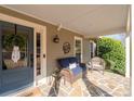 Covered porch with flagstone floor featuring cozy seating and a decorative wreath at 343 Woodstone Dr, Marietta, GA 30068