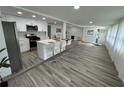 Modern kitchen features white cabinets, stainless appliances, island with bar seating at 2346 Pryor Sw Rd, Atlanta, GA 30315