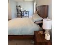 Bedroom featuring a bed, a nightstand, and an office desk in the background at 1176 Whatley Mill Ln, Lawrenceville, GA 30045