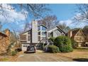 Charming two-story home featuring a wood facade, multi-level deck, and attached two-car garage at 2541 Deer Isle Cv, Lawrenceville, GA 30044