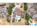 An aerial view of the home with a pool, manicured backyard, and a private driveway at 3167 Bay View Dr, Jonesboro, GA 30236