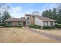 A well-manicured front yard with a stone and stucco facade at 3167 Bay View Dr, Jonesboro, GA 30236