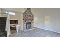 Bright living room showcasing a stone fireplace and modern flooring at 508 Jaywood Dr, Stone Mountain, GA 30083