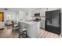 Modern kitchen featuring stainless steel appliances, granite countertops, a breakfast bar, and ample cabinet space at 6089 Mallory Rdg, Union City, GA 30291