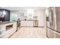 Modern kitchen with stainless steel appliances and white cabinets at 4230 Deerwood Se Pkwy, Smyrna, GA 30082