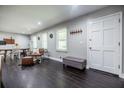 Spacious living room area with new floors and lots of light from the windows at 4230 Deerwood Se Pkwy, Smyrna, GA 30082