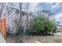 View of the property line with wood fence featuring mature landscaping and yard at 1340 Bernard Nw St, Atlanta, GA 30314