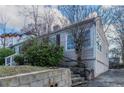 Exterior view of home showcasing a low-maintenance landscape and a side entrance at 1340 Bernard Nw St, Atlanta, GA 30314
