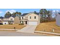 Attractive two-story home with a well-maintained lawn and a convenient two-car garage at 310 Indian Lake Trl, Villa Rica, GA 30180