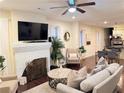 Cozy living room with a fireplace, hardwood floors, lots of natural light and neutral decor at 24 Moreland Ne Ave, Atlanta, GA 30307