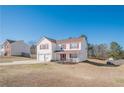 Inviting two-story home with red shutters, a two-car garage, and a spacious front yard at 351 Grandview Cir, Powder Springs, GA 30127