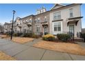 Street view of townhomes, showcasing landscaping, sidewalks, and charming architecture at 2051 Glenview Park Cir, Duluth, GA 30097