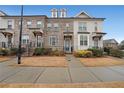 Inviting townhome with manicured front yard and a welcoming entrance at 2051 Glenview Park Cir, Duluth, GA 30097