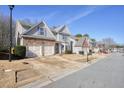 Beautiful two-story home with a well manicured lawn, two car garage, and neutral paint at 102 Crescent Woode Way, Dallas, GA 30157