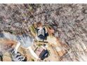 Aerial view of a residential home site surrounded by lush trees at 6225 Leeward Tide Ct, Cumming, GA 30041